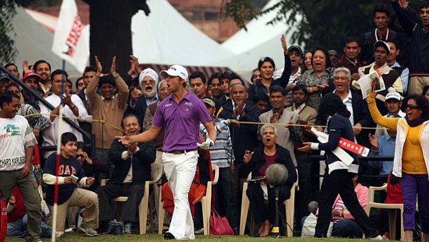 Rikard Karlberg celebrates after chipping in on the 18th to seal victory at the 2010 Hero Honda Indian Open -- his second title of the year.