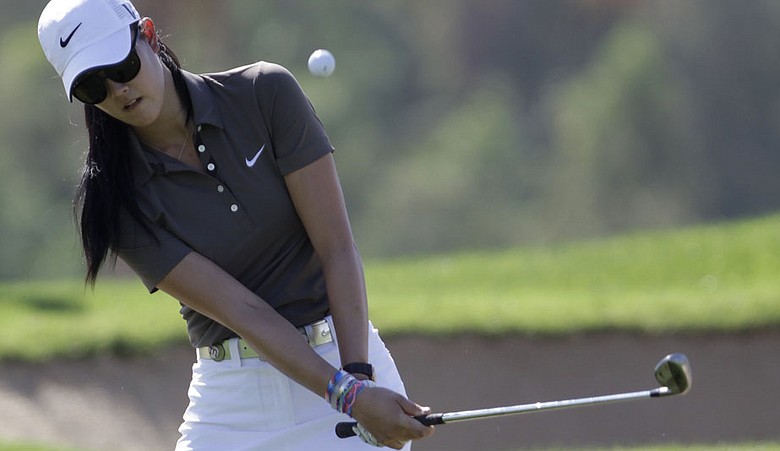 USA's Michelle Wie playing a chip shot onto the eight green, during the first round of the Omega Dubai Ladies Masters golf tournament, held at the Emirates Golf Club, Dubai, Wednesday Dec 8, 2010. (AP Photo/Francois Steenkamp)