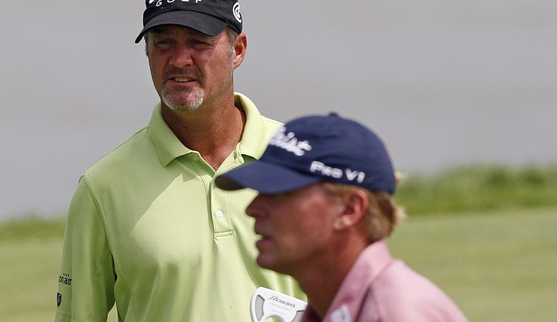 Steve Stricker, right, and Jerry Kelly putt on the eighth hole during a practice round for the PGA Championship.