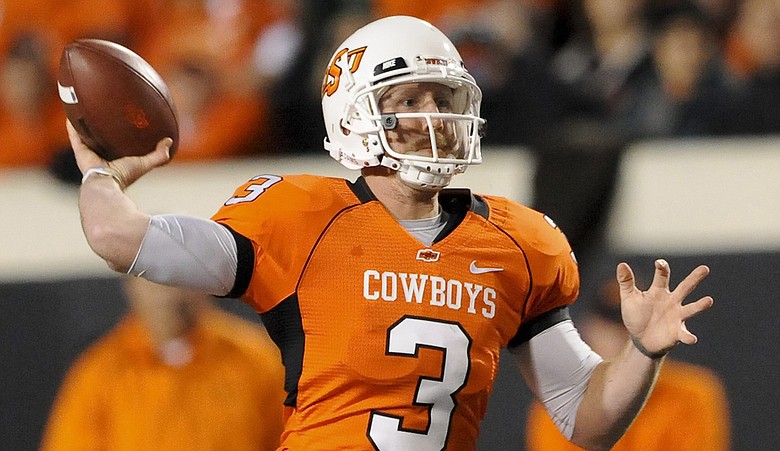 Former Oklahoma State quarterback Brandon Weeden during a football game last fall. Weeden announced Jan. 12 that he will attempt to walk on to the golf team.