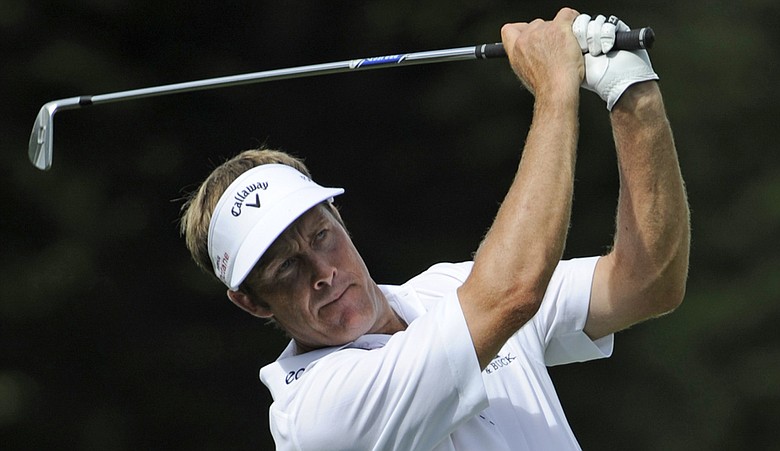 Stuart Appleby hits his second shot on the 14th hole during the first round of the Sony Open in Hawaii held at Waialae Country Club.