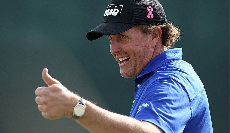Phil Mickelson celebrates after his birdie putt on the 16th hole during the second round of the Waste Management Phoenix Open at TPC Scottsdale on February 5, 2011.
