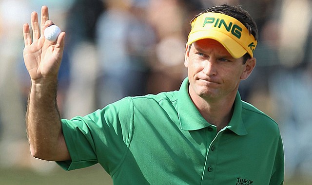 With the lead, Mark Wilson waves to the crowd after finishing the third round of the Waste Management Phoenix Open at TPC Scottsdale on Feb. 6, 2011.