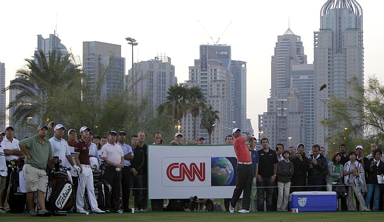 Tiger Woods plays a shot during a practice round in advance of the Dubai Desert Classic.