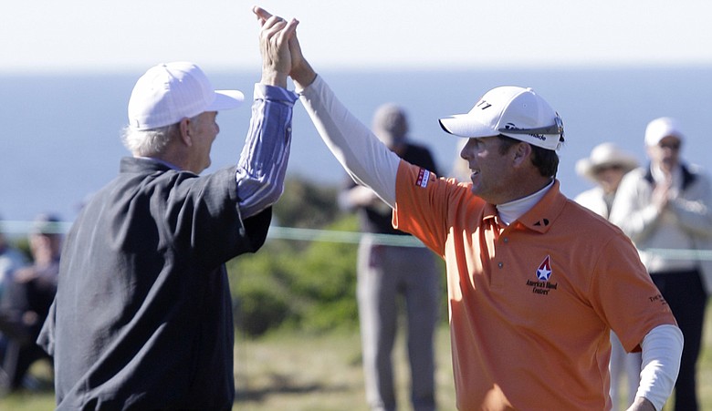 D.A. Points, right, is greeted by actor Bill Murray, left, after chipping in for a birdie on the 16th green of the Monterey Peninsula Country Club during the first round of the Pebble Beach National Pro-Am in Pebble Beach, Calif., Thursday, Feb. 10, 2011.