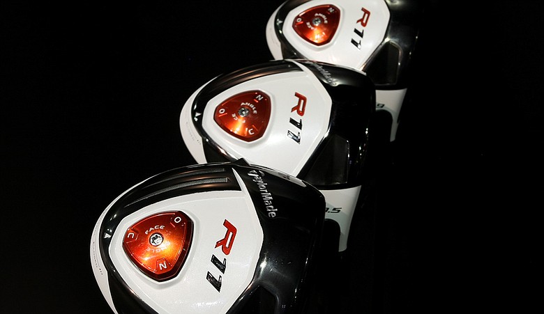 TaylorMade R11: Yes, it's white on top, but it might be the red disc on bottom that has more significance for players. A twist of that button allows the club's alignment and lie to be adjusted independently of the loft, which can be adjusted at the hosel. The club also has weights that can be adjusted to make it three ways to change the clubhead. TaylorMade also has a new Burner SuperFast 2.0 driver.
