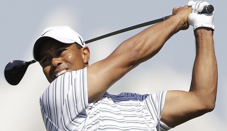 Tiger Woods tees off on the fifth hole during Round 3 of the Dubai Desert Classic.