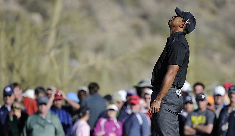 Tiger Woods reacts to his missed putt on the 17th hole during the first round of the World Golf Championships Accenture Match Play Championship.