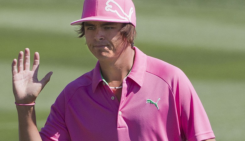 Rickie Fowler reacts to the crowd as he approaches the 12th green while playing Phil Mickelson during the second round of the WGC Match Play Championship.