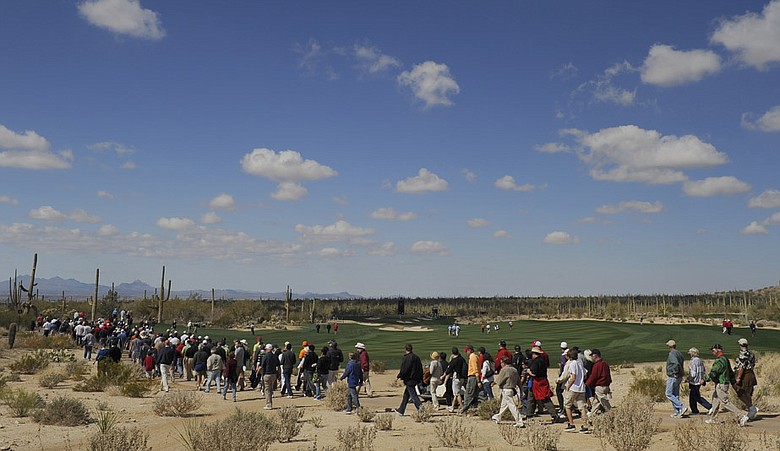 Fans cross the fifth fairway during the second round of the Accenture Match Play Challenge.