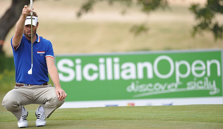 Raphael Jacquelin of France lines up his putt on the eighth hole during the third round of the Sicilian Open at the Donnafugata golf resort and spa on March 19, 2011 in Ragusa, Italy.