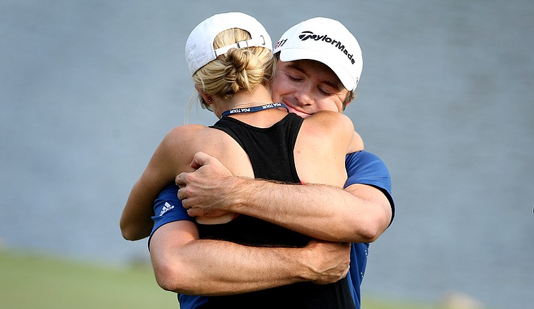 Martin Laird hugs his fiance Meagan after winning the Arnold Palmer Invitational.