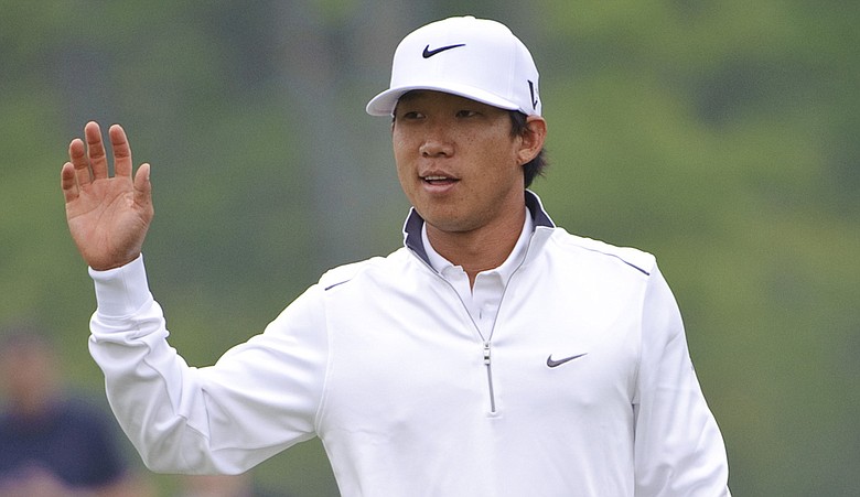 Anthony Kim waves after making birdie on the 15th hole during the second round of the Houston Open.