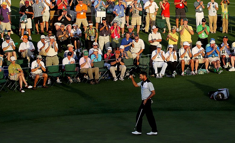 Alvaro Quiros of Spain waves to the patrons on the 18th hole during the first round of the 2011 Masters Tournament at Augusta National Golf Club on April 7, 2011 in Augusta, Georgia.