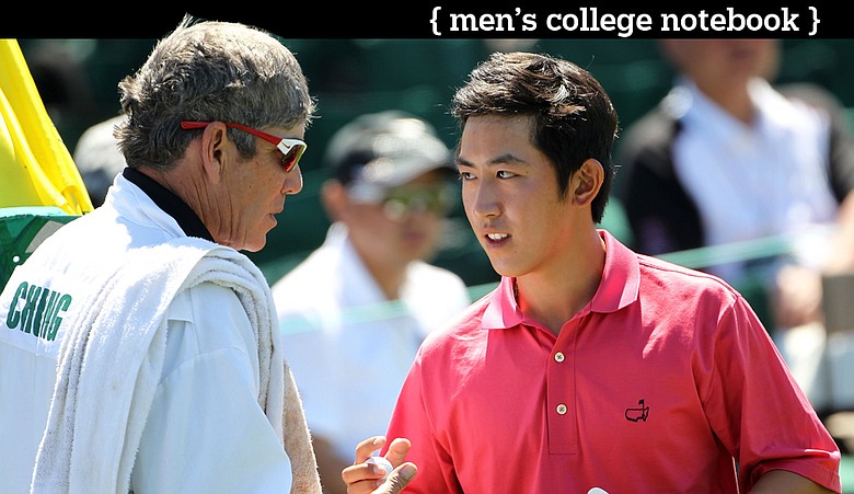Stanford's David Chung shakes hands with his caddie and coach Adam Schriber on the 18th green during the first round of the 2011 Masters.