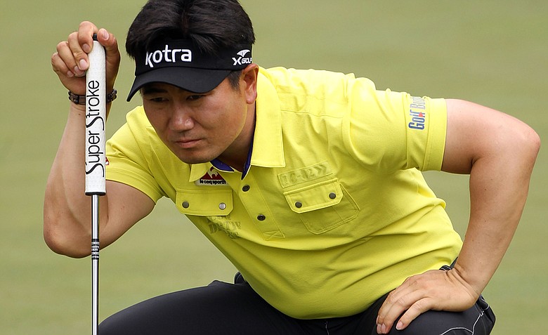 Y.E. Yang of South Korea lines up a putt on the ninth green during the second round of the 2011 Masters Tournament at Augusta National Golf Club on April 8, 2011 in Augusta, Georgia.