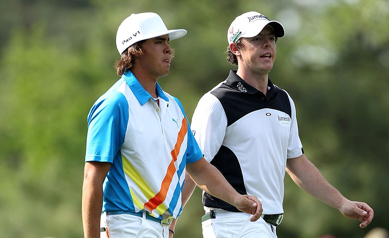 Rickie Fowler and Rory McIlroy walk up the 14th hole together during the second round of the 2011 Masters.
