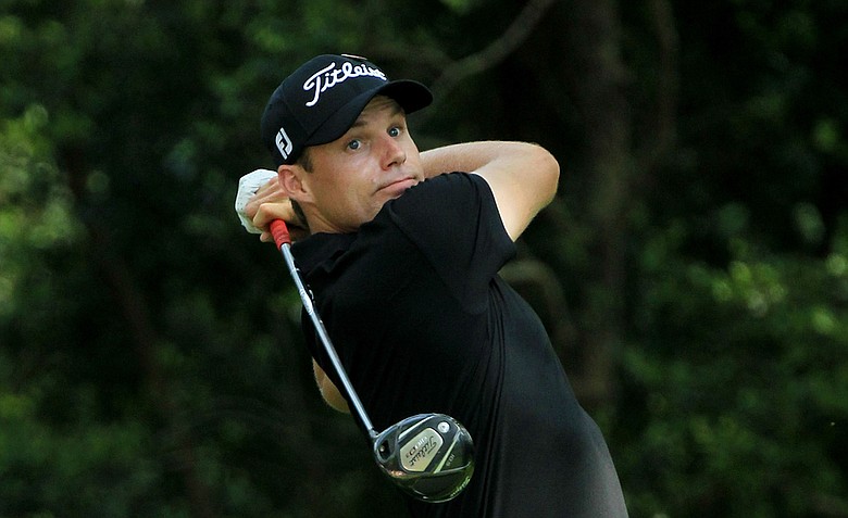 Nick Watney watches his tee shot on the second hole during the third round of the 2011 Masters.