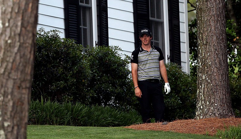 Rory McIlroy waits on the 10th hole after an errant tee shot during the final round of the 2011 Masters.