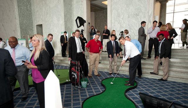 Attendees taking part in the We Are Golf exhibit in the Rayburn Foyer during the observance of National Golf Day in Washington, D.C., on Wednesday, April 13th, 2011. 