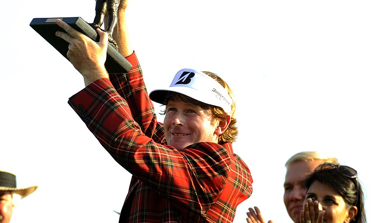 Brandt Snedeker lifts the trophy after winning the 2011 Heritage. The Heritage, at Hilton Head Island, S.C., has a new sponsor in 2011, RBC.