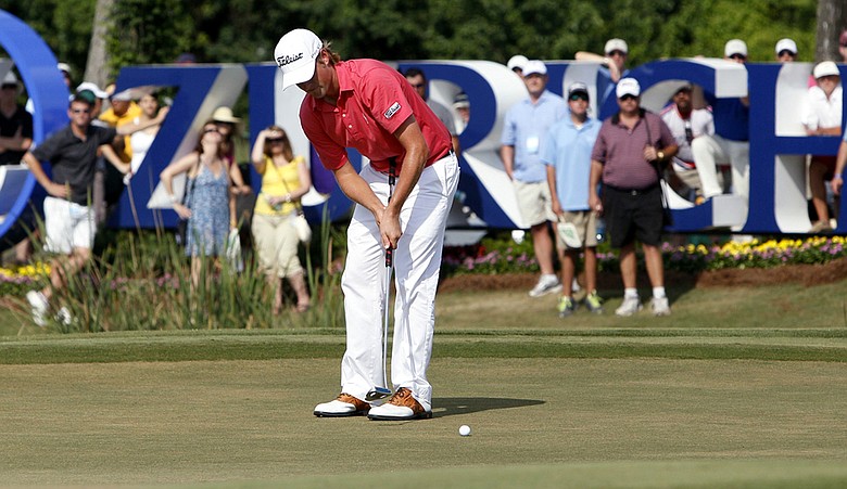 Webb Simpson putts on the 17th green during the final round of the Zurich Classic.