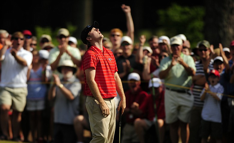 Russell Henley looks up in relief after sinking a putt on the 18th hole during the final round of the Nationwide Tour's Stadion Classic golf tournament on Sunday, May 8, 2011 in Athens, Ga.