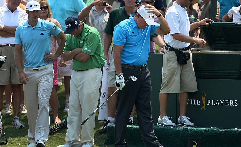 Phil Mickelson reacts to hitting his tee shot into the water at No. 17 during a Tuesday practice round at The Players Championship at TPC Sawgrass.