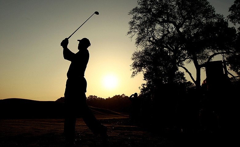 Tiger Woods hits a shot during a practice round prior to the start of the 2010 Players Championship.