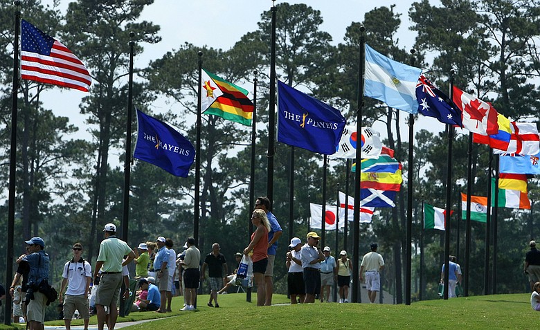 Fans gather around the driving range during Tuesday's practice round for The Players Championship at TPC Sawgrass.
