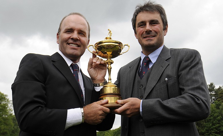 Frenchmen Thomas Levet (left) and Jean Van de Velde hold the Ryder Cup after it was announced May 17 that France will host the 2018 Ryder Cup.