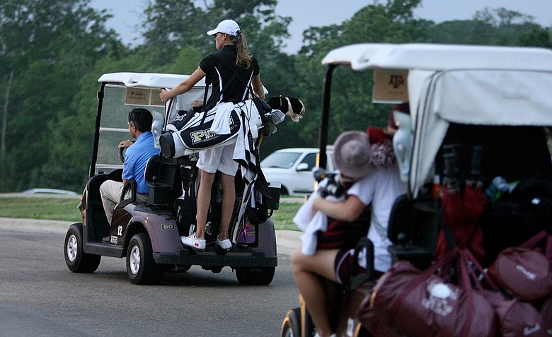Teams head in as play was called due to darkness, the final group has four holes left, during Round 3.