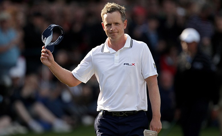 Luke Donald of England acknowledges the crowd on the 18th green during the final round of the BMW PGA Championship at the Wentworth Club on May 29, 2011 in Virginia Water, England.