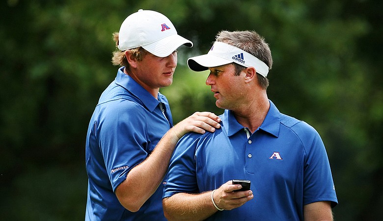 Augusta State head coach Josh Gregory (right) talks with Henrik Norlander during the final round of stroke play at the NCAA Championship.