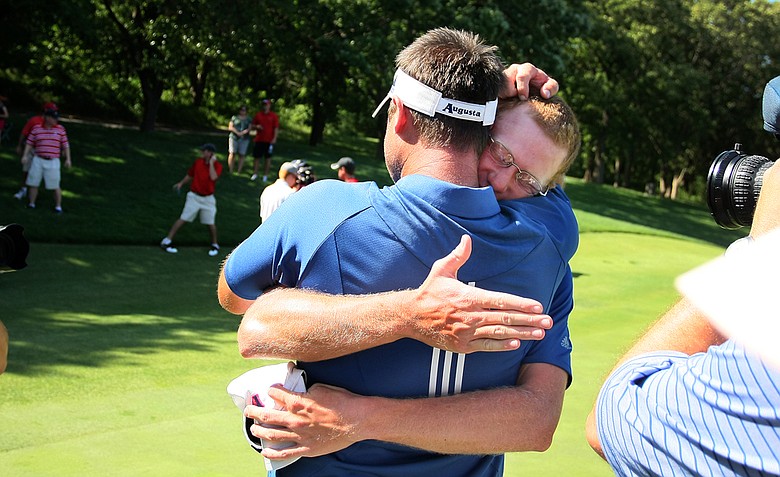 Augusta State head coach Josh Gregory shares an embrace with Carter Newman after they won the 2011 NCAA Division I Men's Golf Championship at Karsten Creek in Stillwater, Oklahoma. Newman won his match, 7 and 5.