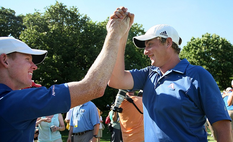 Augusta State's Mitchell Krywulycz, left, and Henrik Norlander celebrate after the 2011 NCAA Division I Men's Golf Championship at Karsten Creek in Stillwater, Oklahoma.