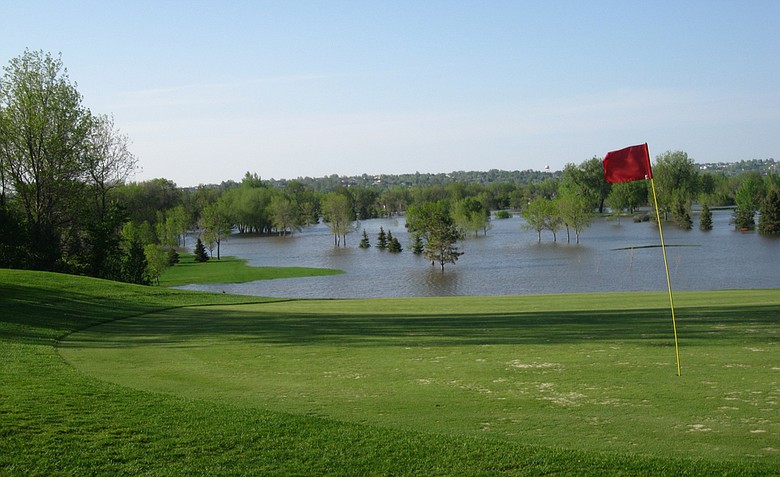 Looking north across Souris Valley Golf Course at two normally dry upland holes, the 414-yard par-4 fourteenth hole (left) and the 522-yard, par-5 15th (right).