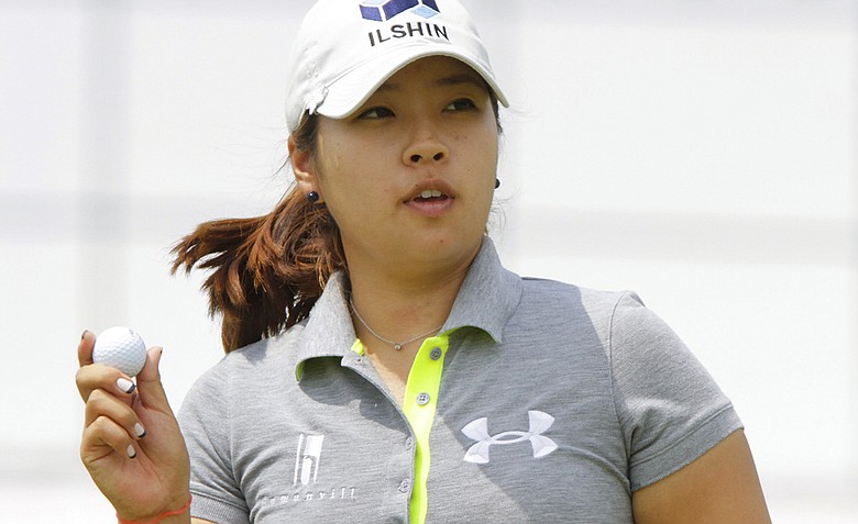 Mindy Kim acknowledges to the gallery on the 18th hole during the second round of the LPGA State Farm Classic golf tournament Friday, June 10, 2011, in Springfield, Ill.