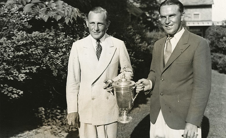 George Von Elm and William Burke (Billy Burke, left to right) are seen here with the U.S. Open trophy in 1931. Billy Burke was the champion and George Von Elm was the runner-up at the championship which was held at the Inverness Club, Toledo, Ohio.
