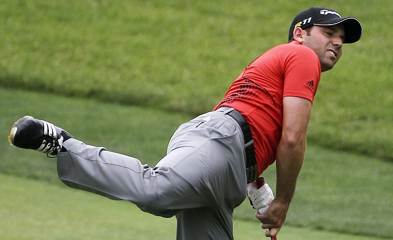 Sergio Garcia, of Spain, watches his shot from the ninth fairway during the third round of the U.S. Open Championship golf tournament in Bethesda, Md., Saturday, June 18, 2011.