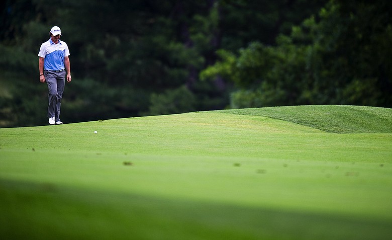 Rory McIlroy approaches his ball on the 15th hole during the third round of the 111th U.S. Open at Congressional Country Club.