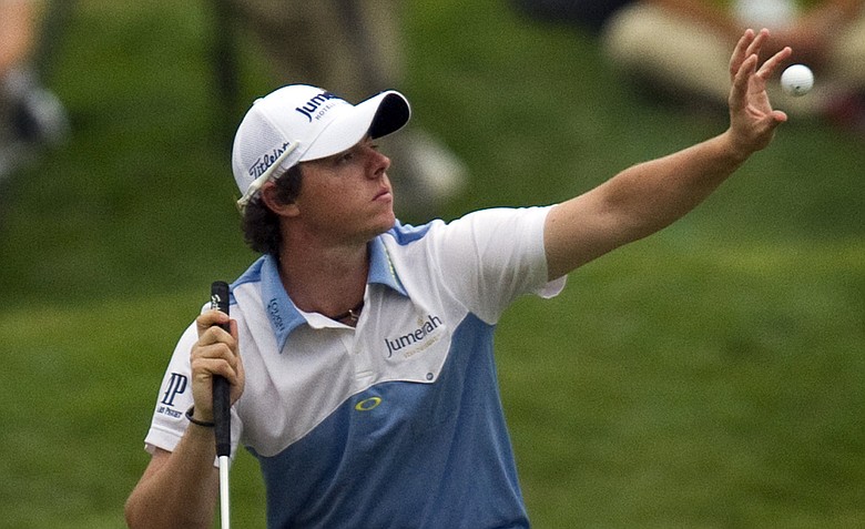 Rory McIlroy catches a ball while on the 18th green during the third round of the 111th U.S. Open at Congressional Country Club.