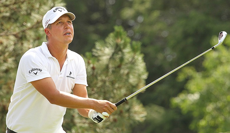 Fredrik Jacobson watches his shot during the final round of the Travelers Championship, where he defeated Ryan Moore and John Rollins by a shot.