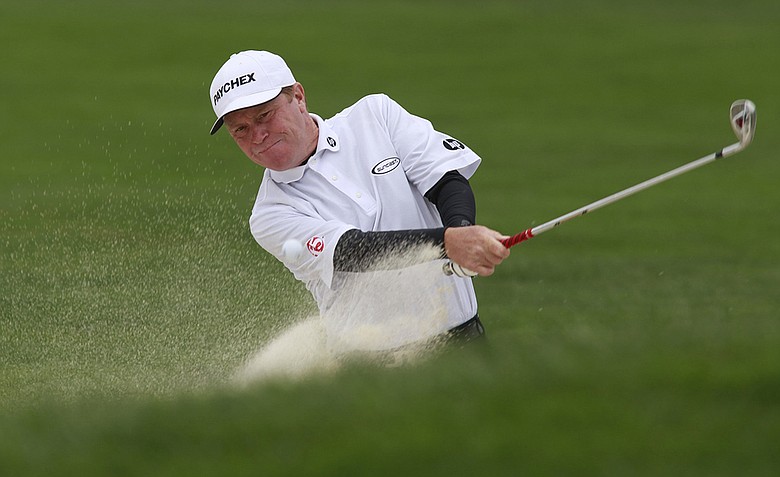 Jeff Sluman hits from a sand trap on the second hole during the final round of the First Tee Open golf tournament in Pebble Beach, Calif. on Sunday, July 10, 2011.