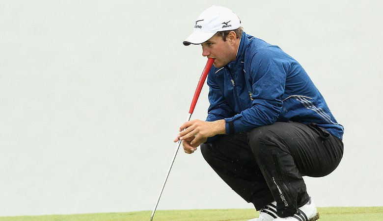Amateur Robert Karlsson of Sweden lines up a putt during the first round for the Nordea Scandinavian Masters.