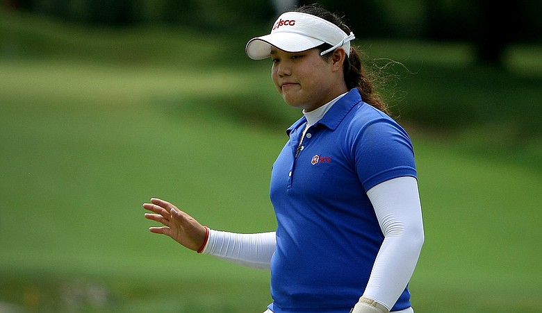 Ariya Jutanugarn acknowledges the crowd at No. 15 during the quarterfinals of the 63rd U.S. Girls' Junior Championship at Olympia Fields Country Club.