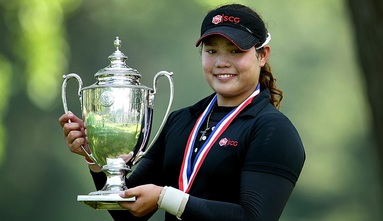 Ariya Jutanugarn poses with the Glenna Collett Vare Trophy after defeating Dottie Ardina, 2 and 1, to win the 63rd U.S. Girls' Junior Championship at Olympia Fields Country Club.