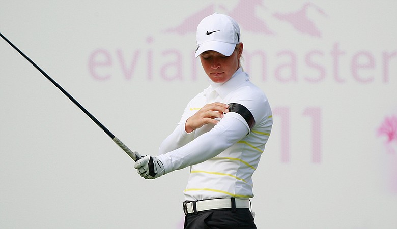 Suzann Pettersen waits on the first tee with a band on her arm after the deadly attacks in her home country during the third round of the Evian Masters.