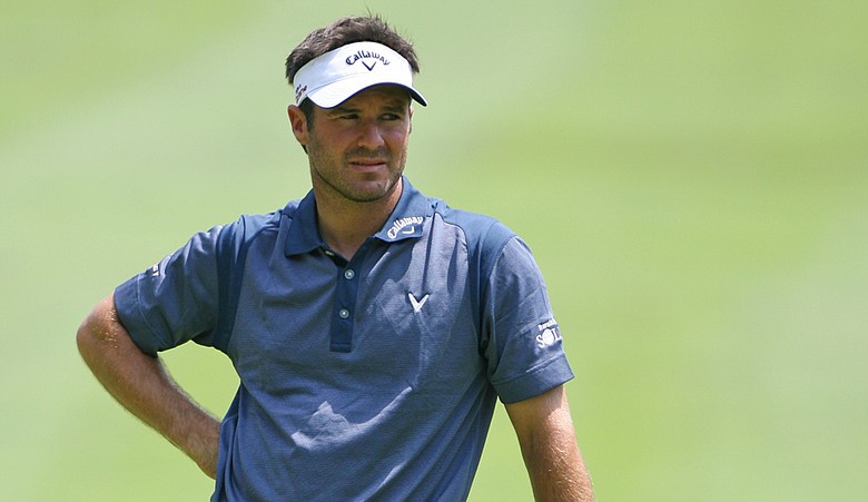 Trevor Immelman stands on the ninth green during the first round of The Greenbrier Classic.