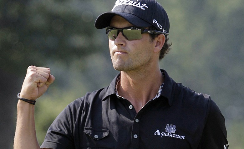 Adam Scott, from Australia, pumps his fist after making birdie on the 14th hole during the final round of the Bridgestone Invitational golf tournament at Firestone Country Club in Akron, Ohio, Sunday, Aug. 7, 2011. Scott won the tournament.